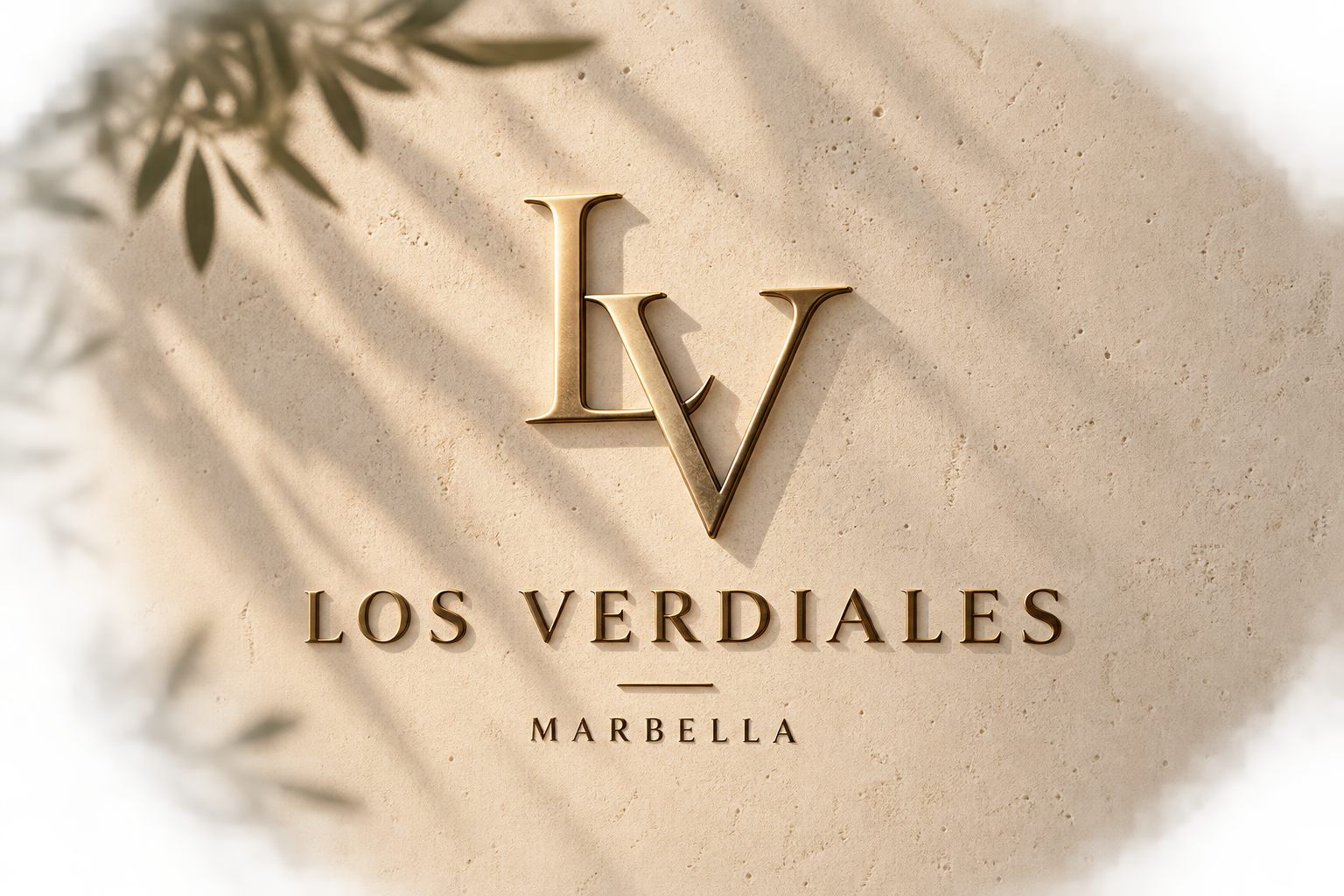 The Los Verdiales monogram in brass on travertine